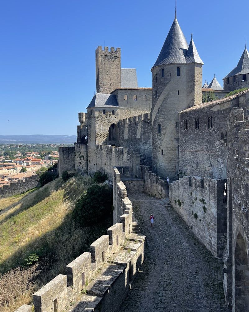 pexels-photo-24553927-24553927 Explore the historic fortified city of Carcassonne, France with its stunning medieval architecture and iconic towers. Cité médiévale
